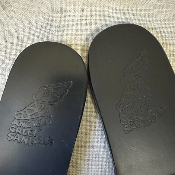 ANCIENT GREEK SANDALS Desmos Stitch Slide Sandals in Black/Light Gold