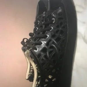 Chanel Black Flower Cutout Leather Sneakers Size 7 EU 37.5
