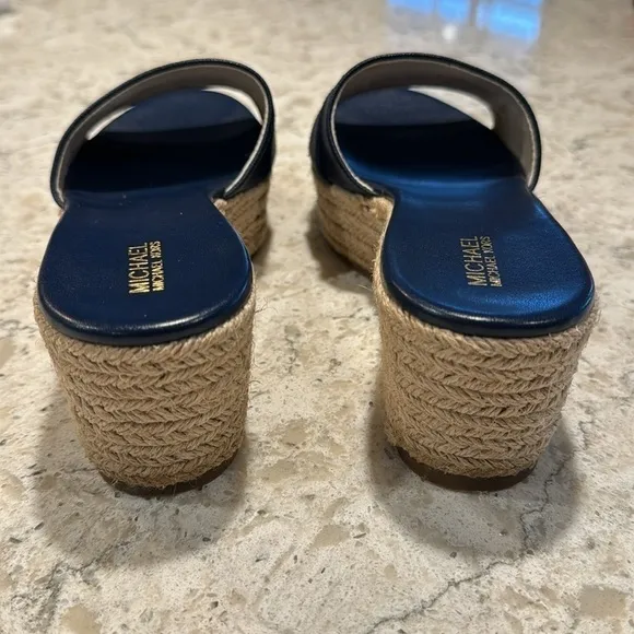 MICHAEL KORS~WOMENS~NAVY~ROUND TOE~SLIP ON SANDALS~WITH GOLD METAL LETTERS~BR