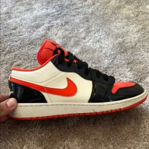 Nike Air Jordan Low Black and Orange Sneakers