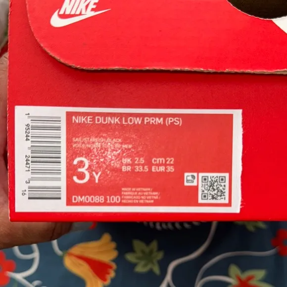 Nike Black and Orange Sneakers with Classic Low-Top Design