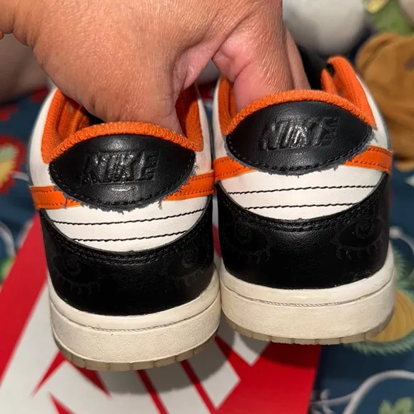 Nike Black and Orange Sneakers with Classic Low-Top Design