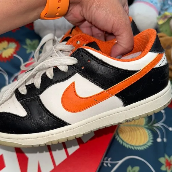 Nike Black and Orange Sneakers with Classic Low-Top Design