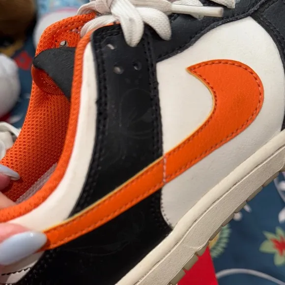 Nike Black and Orange Sneakers with Classic Low-Top Design