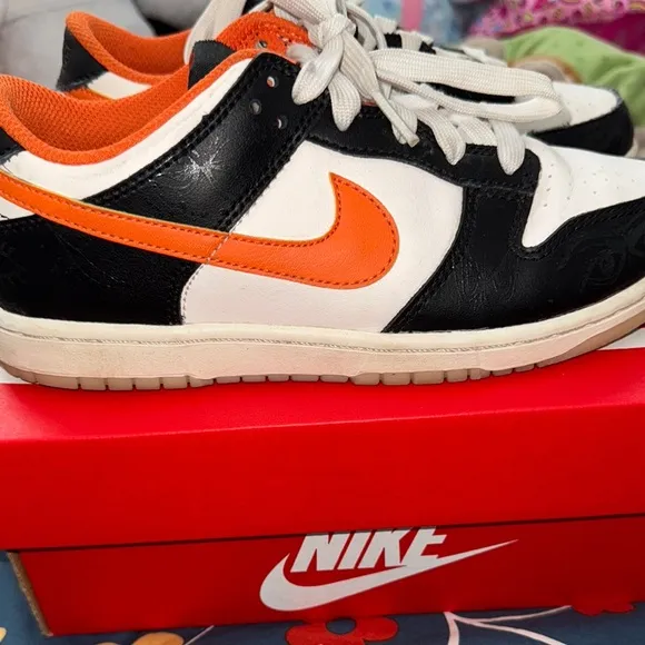 Nike Black and Orange Sneakers with Classic Low-Top Design