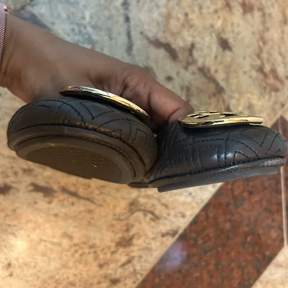 Tory Burch brown with gold emblem flats