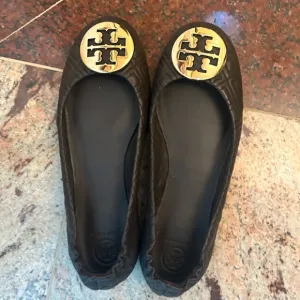 Tory Burch brown with gold emblem flats