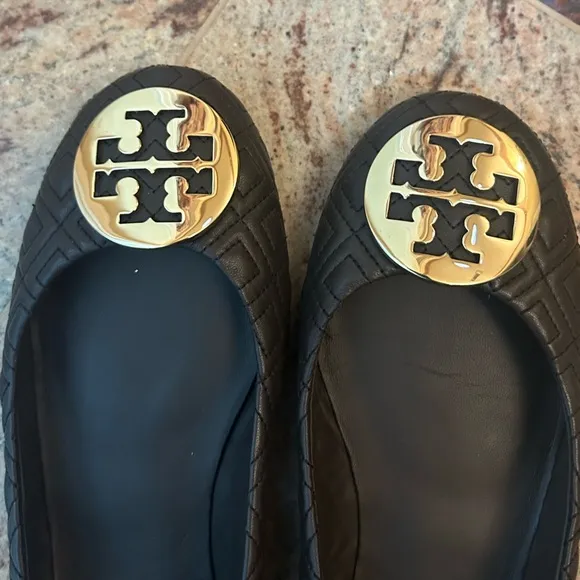 Tory Burch brown with gold emblem flats