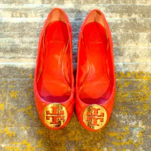 Tory Burch quilted leather flats in burnt orange